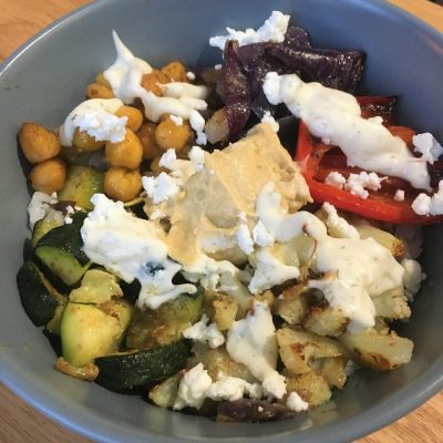 Bowl with roasted veggies on table